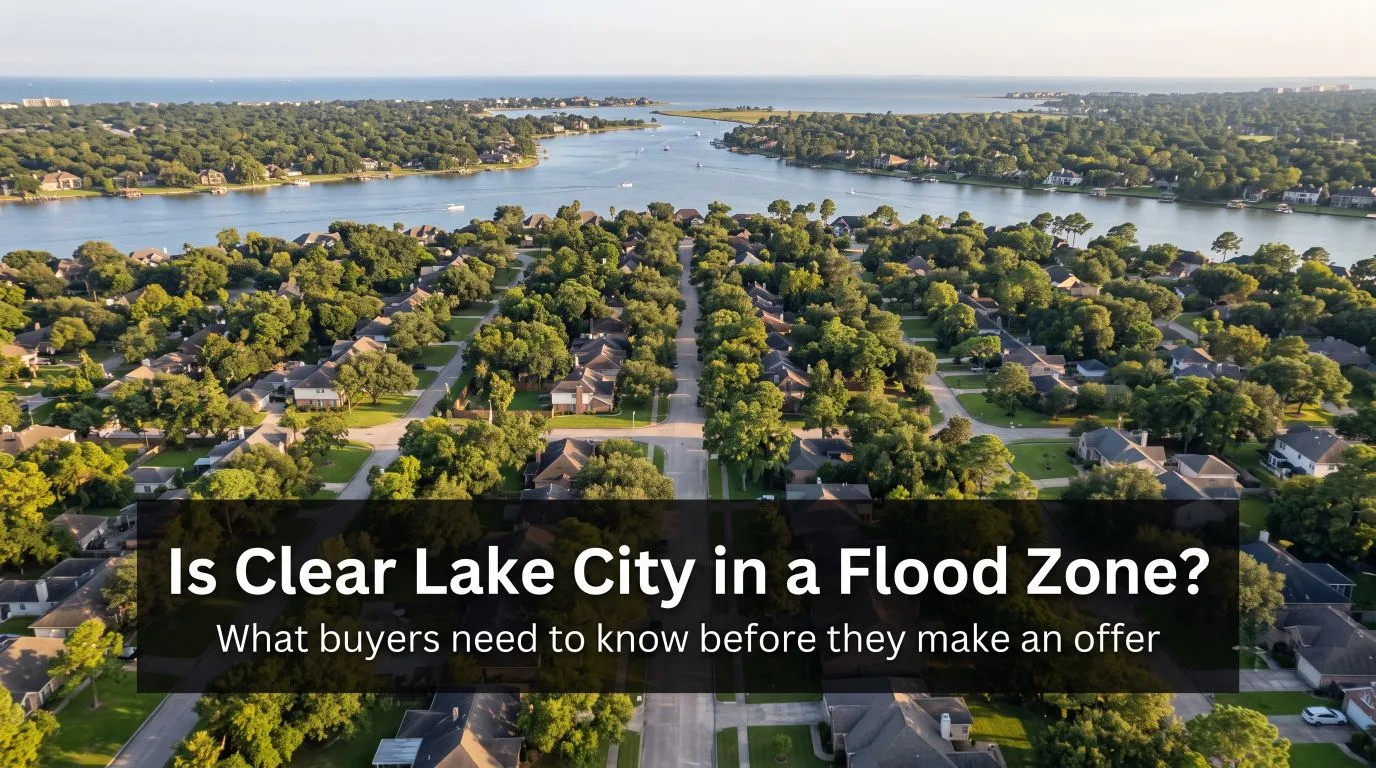 Aerial view of tree-lined streets in a waterfront neighborhood beside a bay, with the title Is Clear Lake City in a Flood Zone? What buyers need to know before they make an offer.