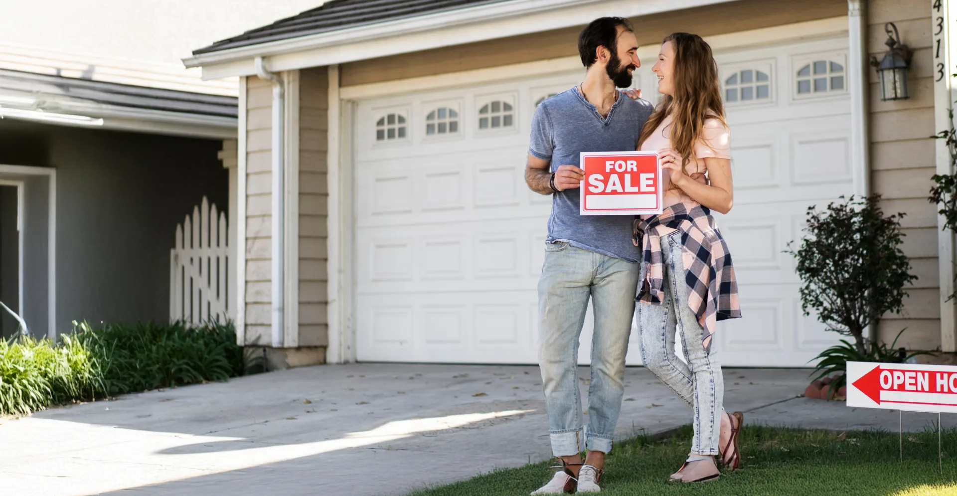 Seller lifestyle: couple with a For Sale sign